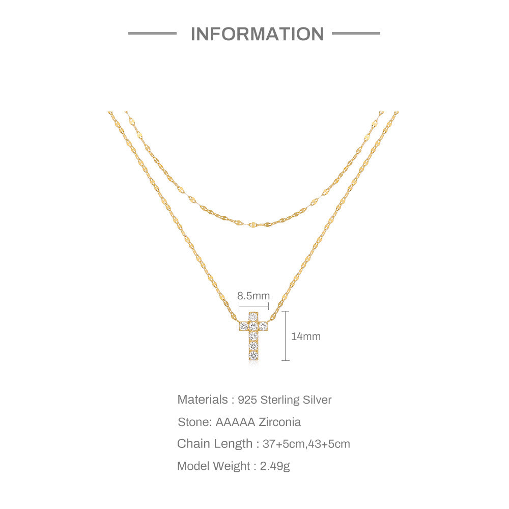Gold necklace with cross pendant and measurement details on a white background