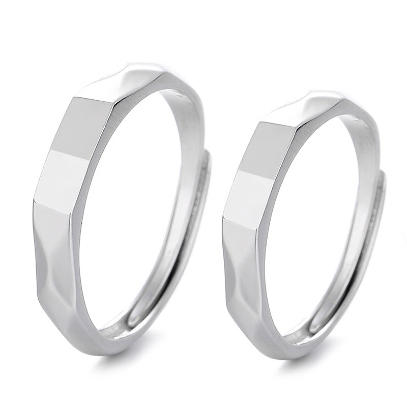 Two S925 Sterling Silver Light Reflection Rings by Jingqian with a hexagonal geometric design. The adjustable rings have a modern, minimalistic appearance and feature polished and matte facets that catch the light. The design gives each ring a unique, angular look.