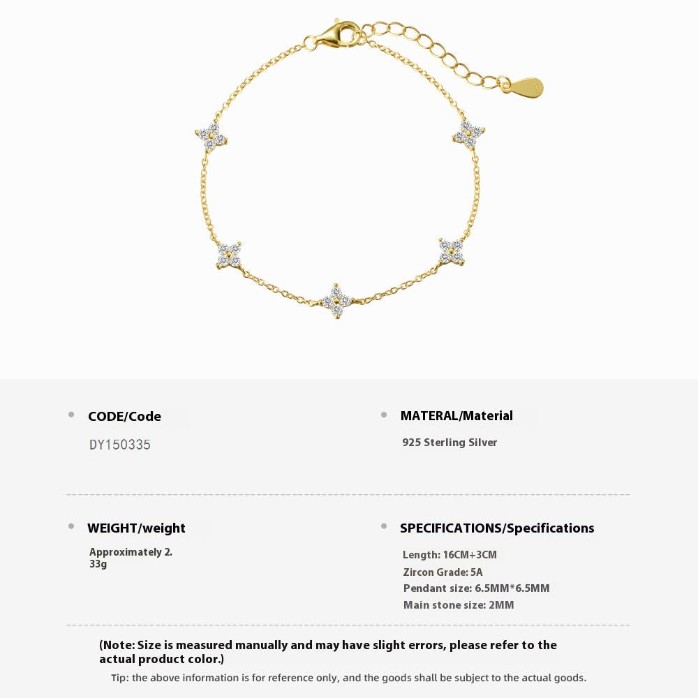 Gold bracelet with star-shaped charms on a white background