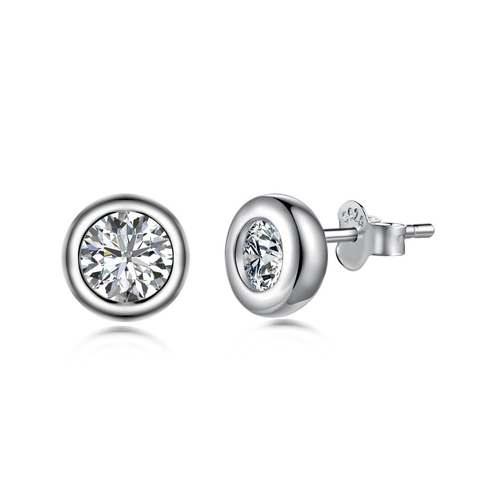 Pair of silver stud earrings with clear gemstones on a white background